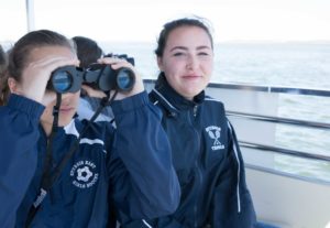 Two girls with binoculars
